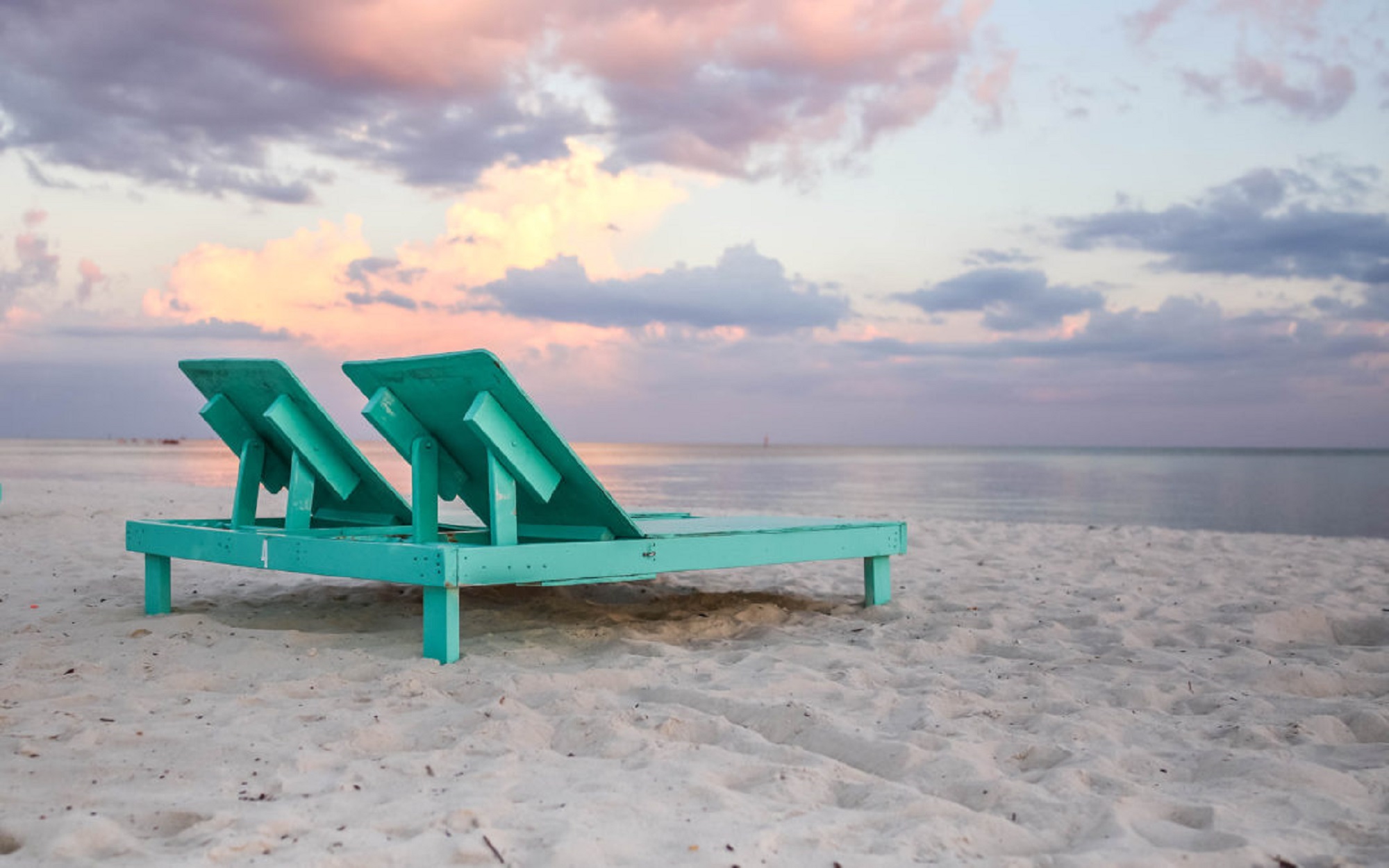 Beach chairs on a sunset beach