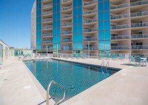 pool with condos in background