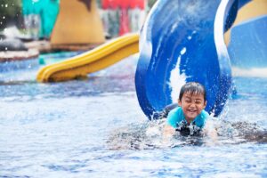 child having fun at water park