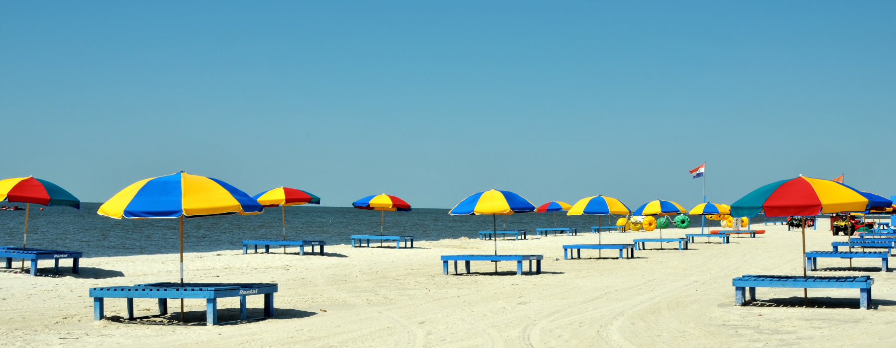 Lounge Chairs and Colorful Umbrellas Biloxi Beach