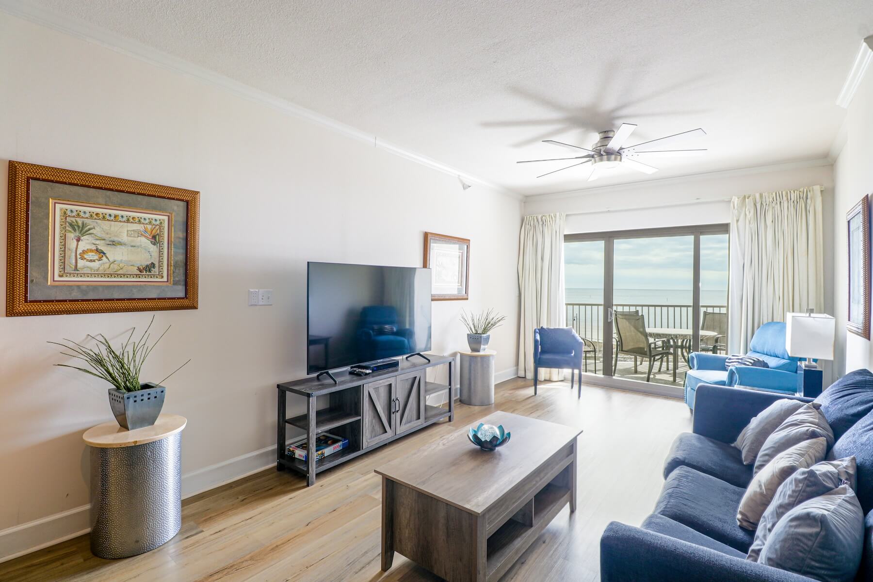 Sea Breeze 402 Deluxe living room and outdoor patio views
