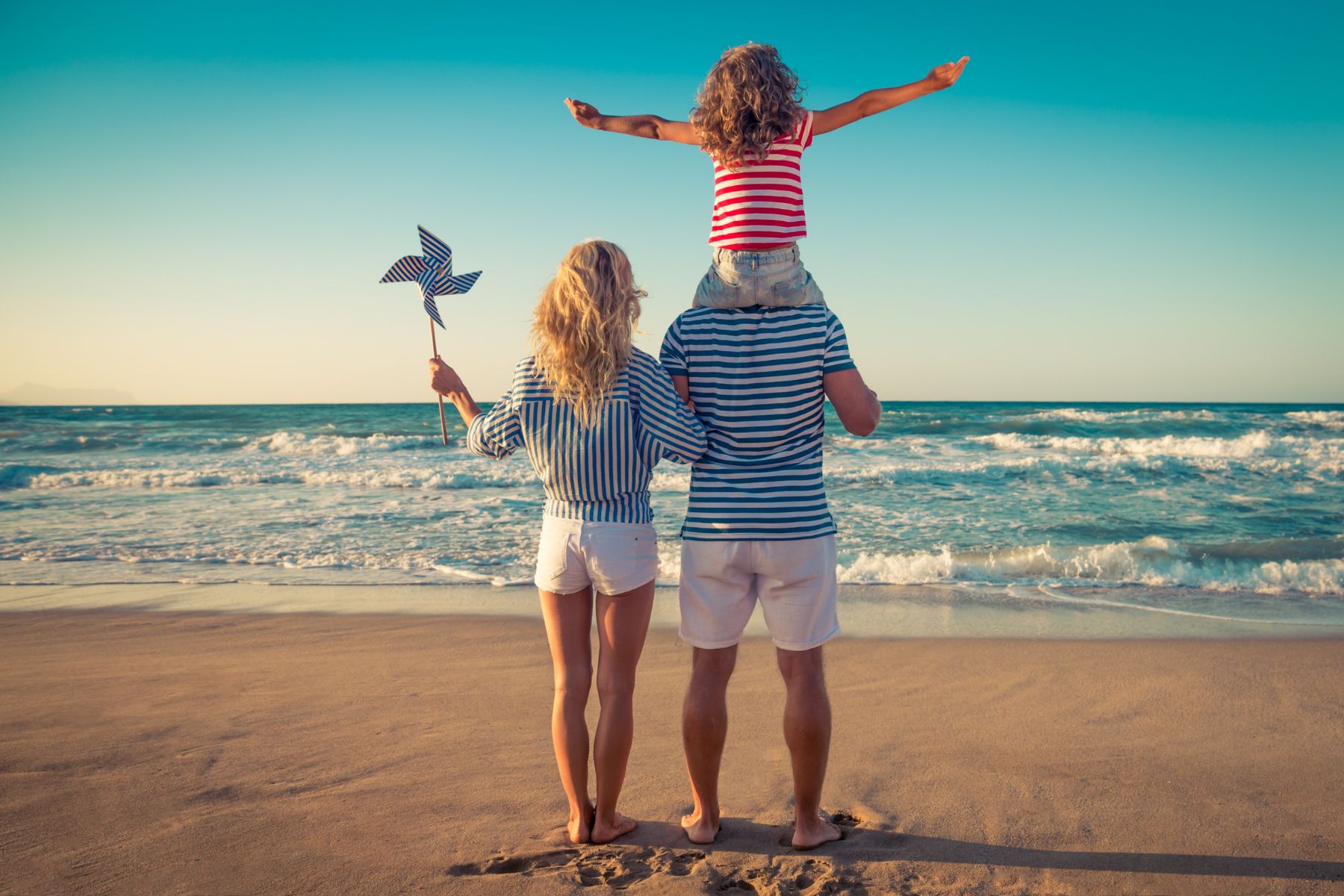 Family on the beach on their first day of vacation
